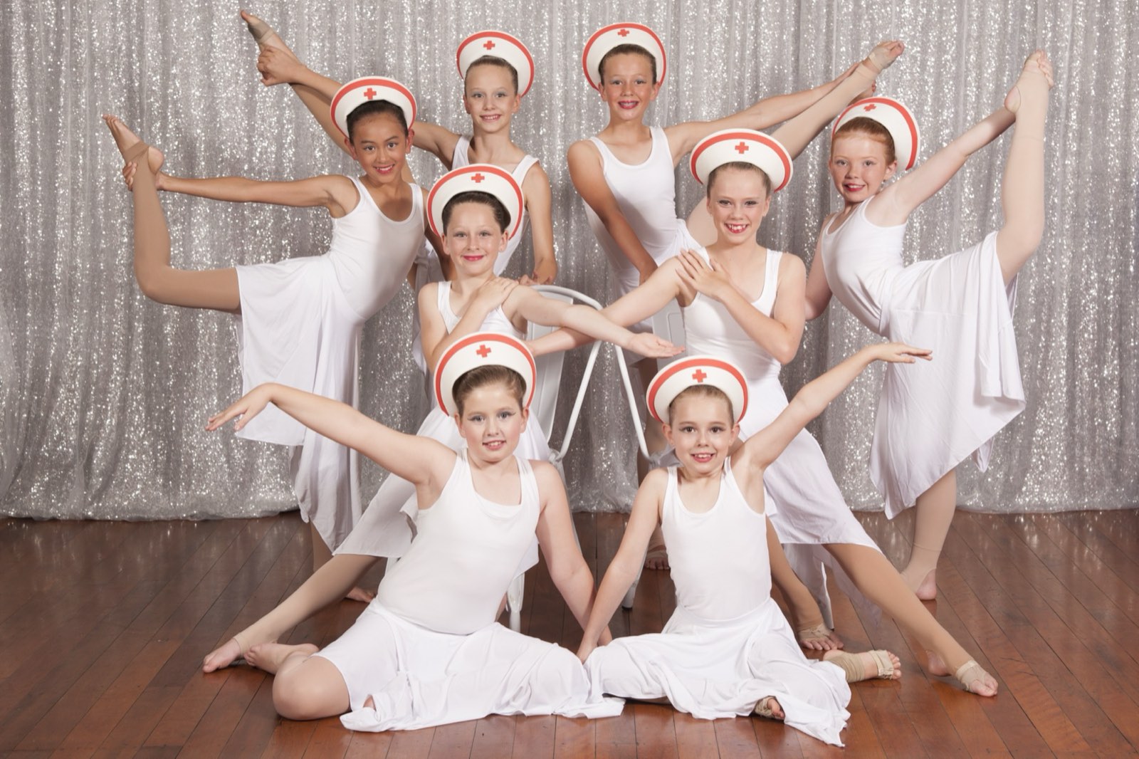 Waves ballet students in white on stage