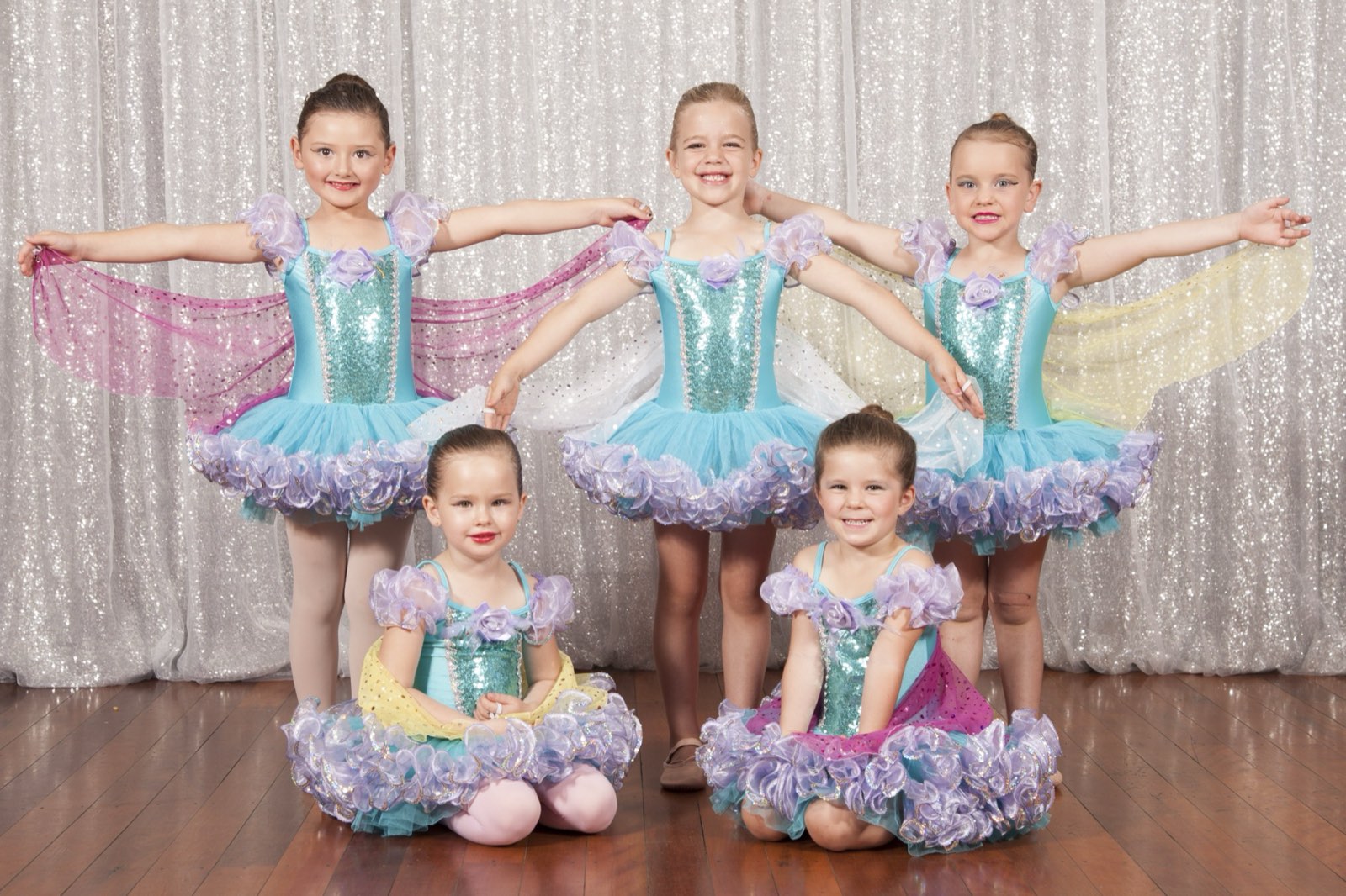 Waves Dance Studio students on stage in tutus at the End of Year Concert